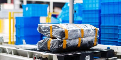 box-on-pallet-lying-on-production-line-on-factory-2024-11-07-13-21-59-utc